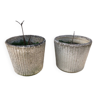 Two round old stone planters