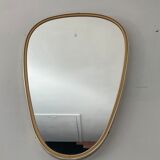 Free-form asymmetrical mirror from the 60s and 70s