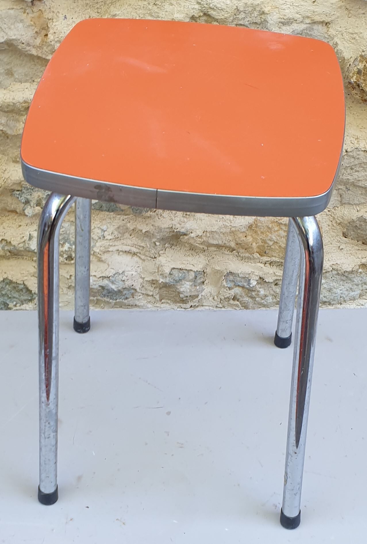 Orange formica stool