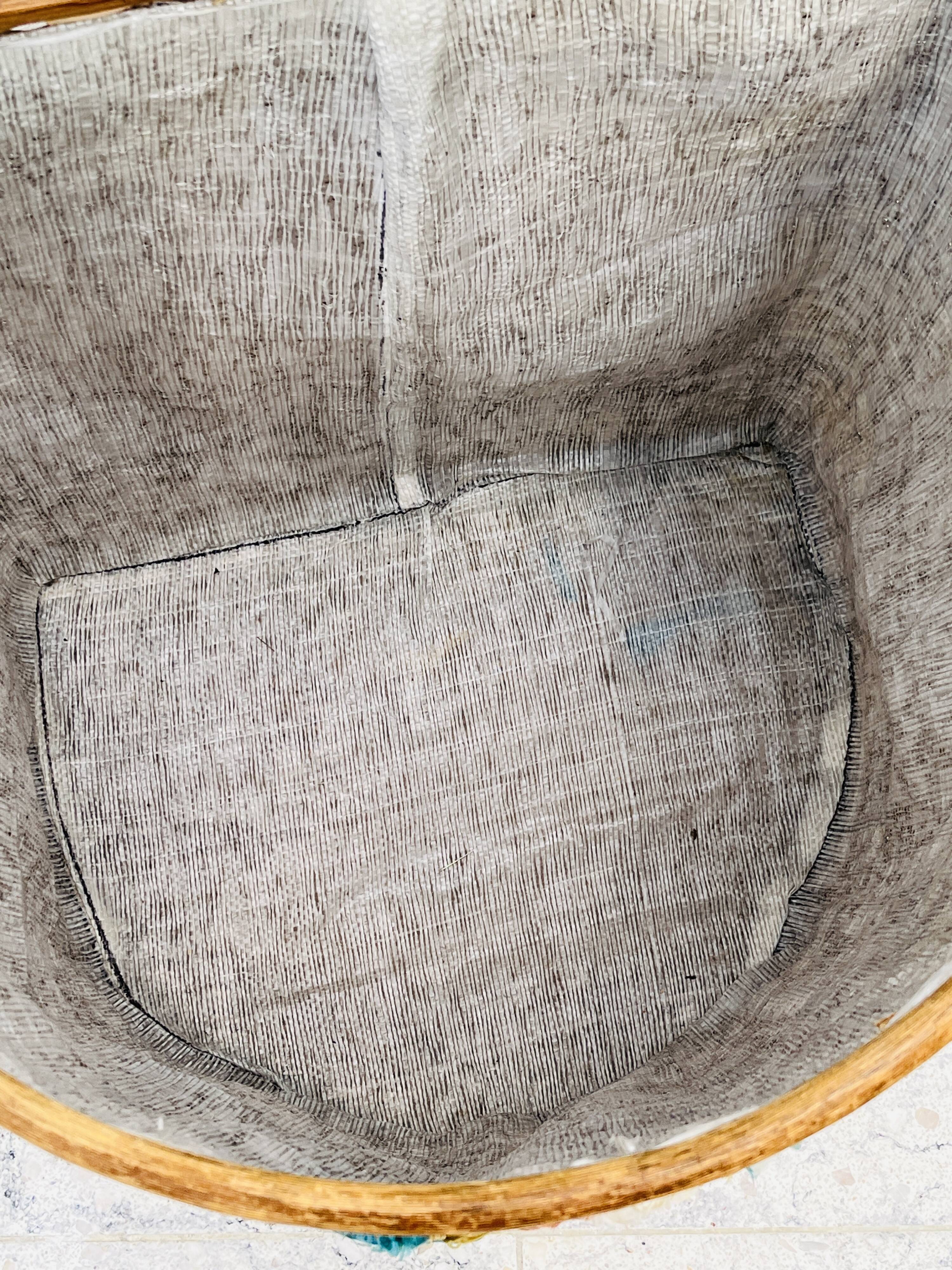 Vintage wicker mannequin with colourful floral decoration.