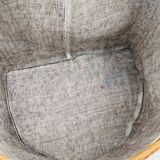 Vintage wicker mannequin with colourful floral decoration.