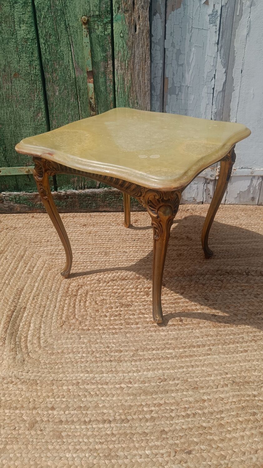 Vintage side table in gilded brass with an onyx top.