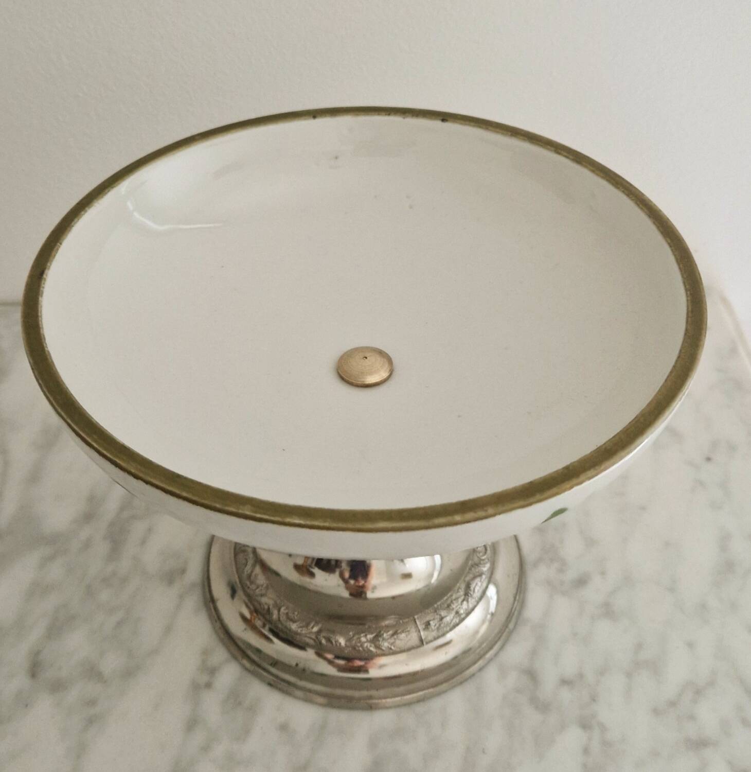 Porcelain cup on silver metal foot