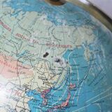 Luminous world map in tripod glass