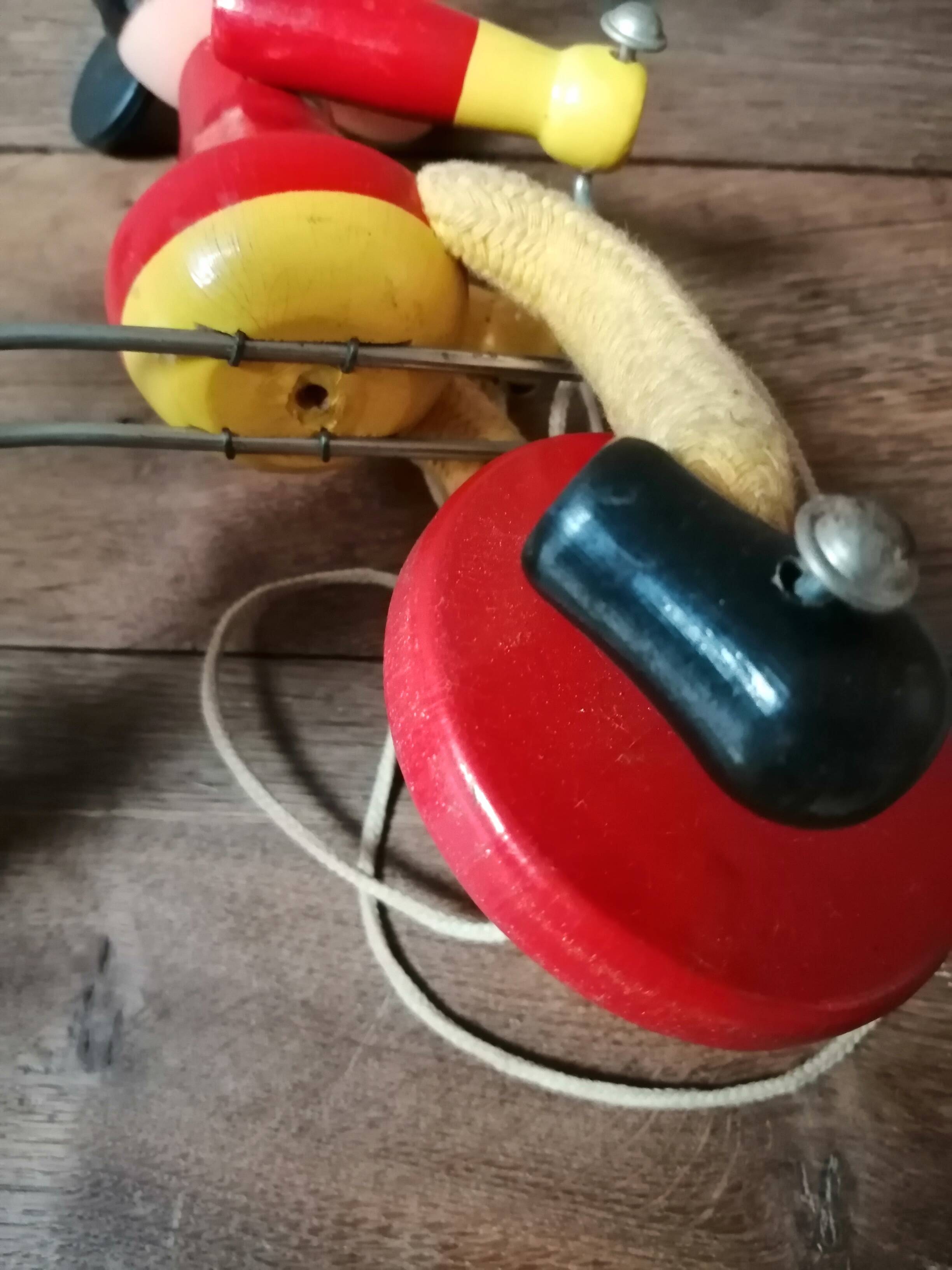 Old Mickey Mouse toy on his wooden tricycle