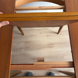 Vintage Scandinavian round table from the 50s and 60s in extendable teak with ra.