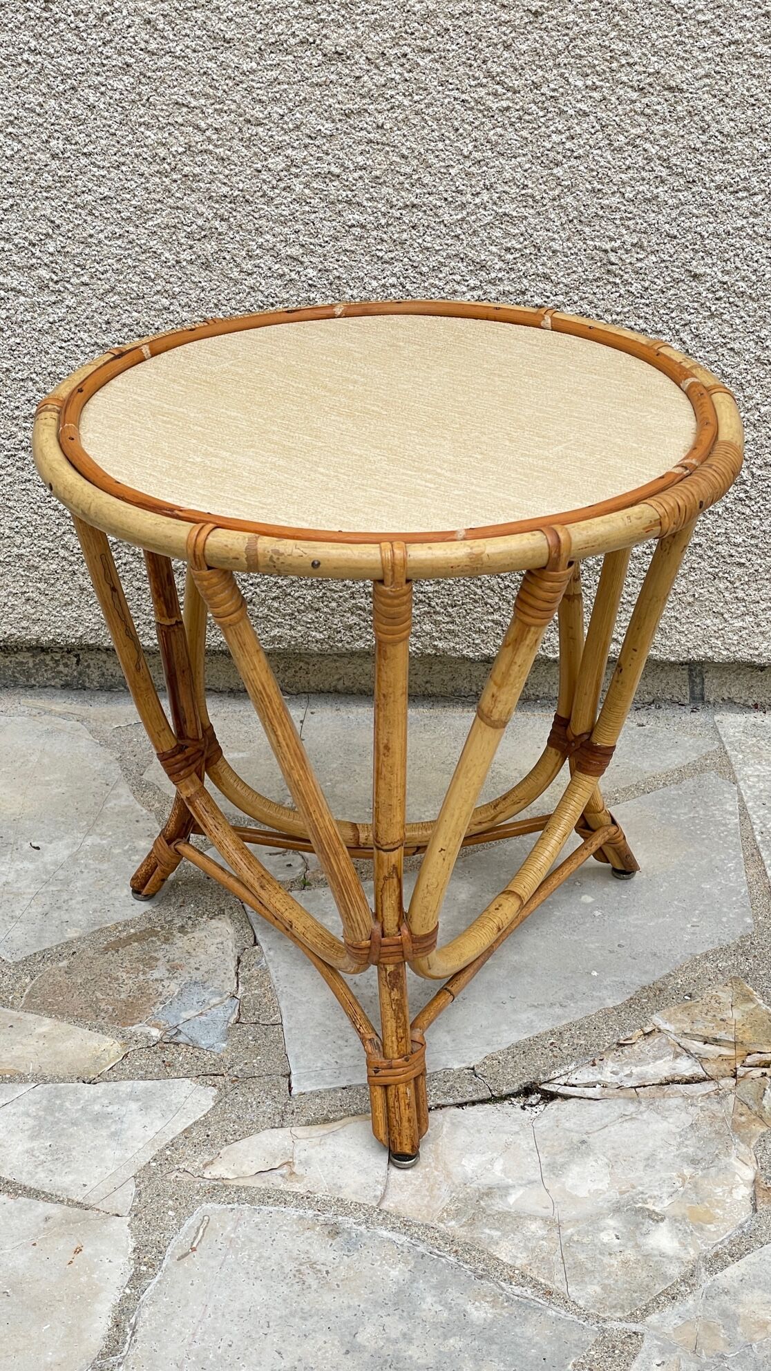Round coffee table in vintage rattan