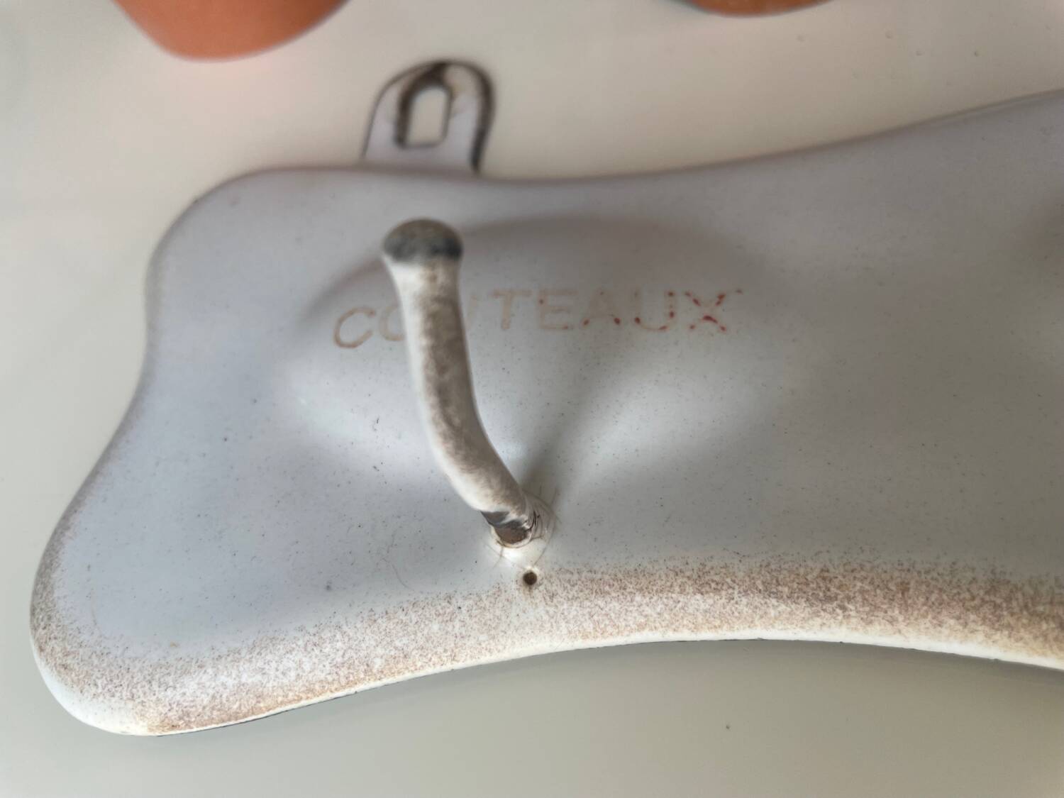 Enamelled sheet metal with inscriptions and hooks