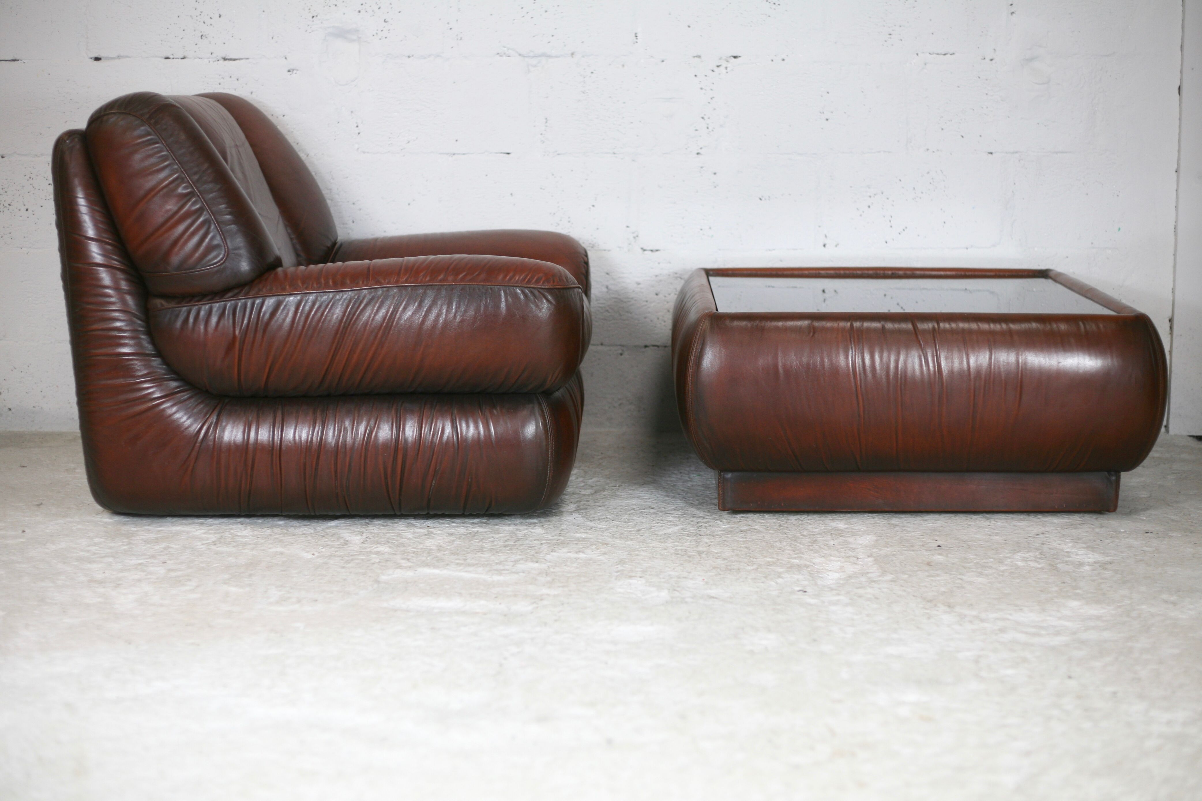 Leather armchair and coffee table set, Italy, circa 1970. Space Age