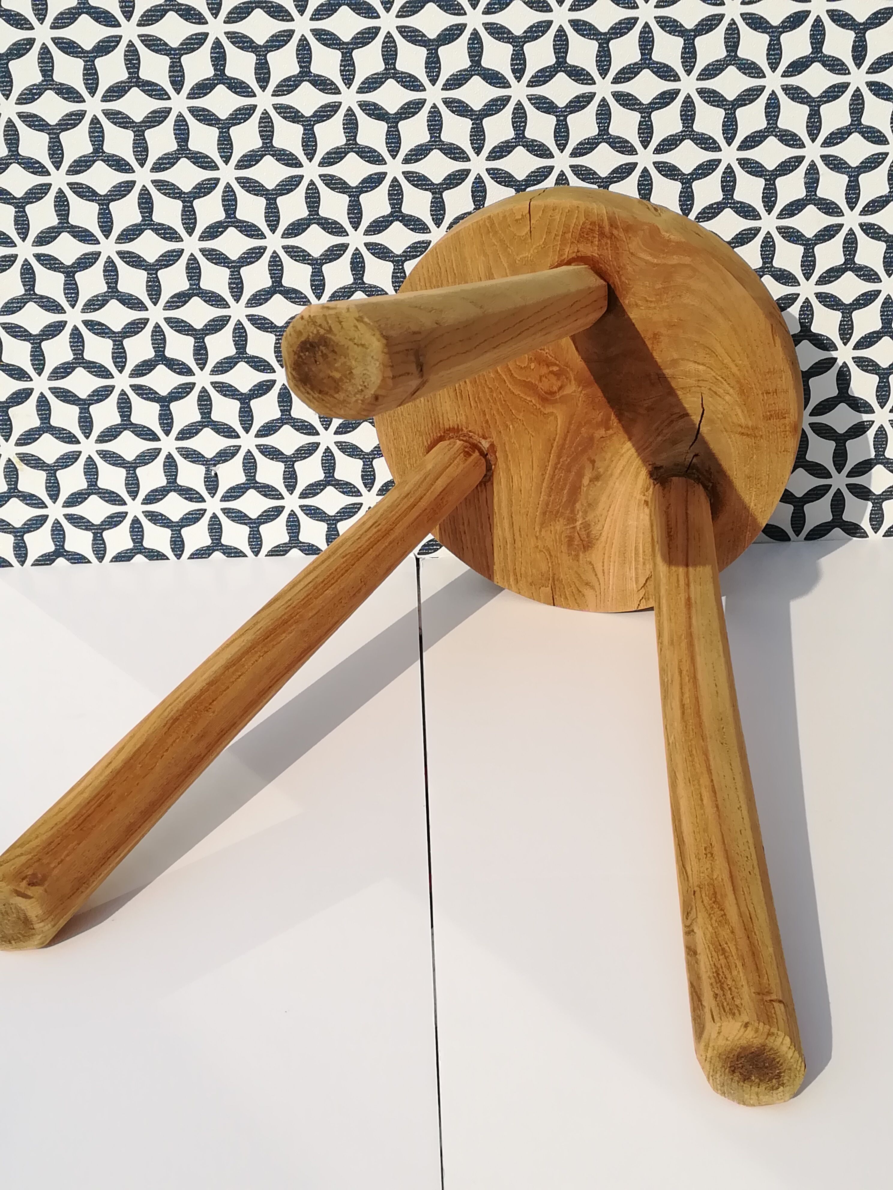 Crude wooden tripod stool