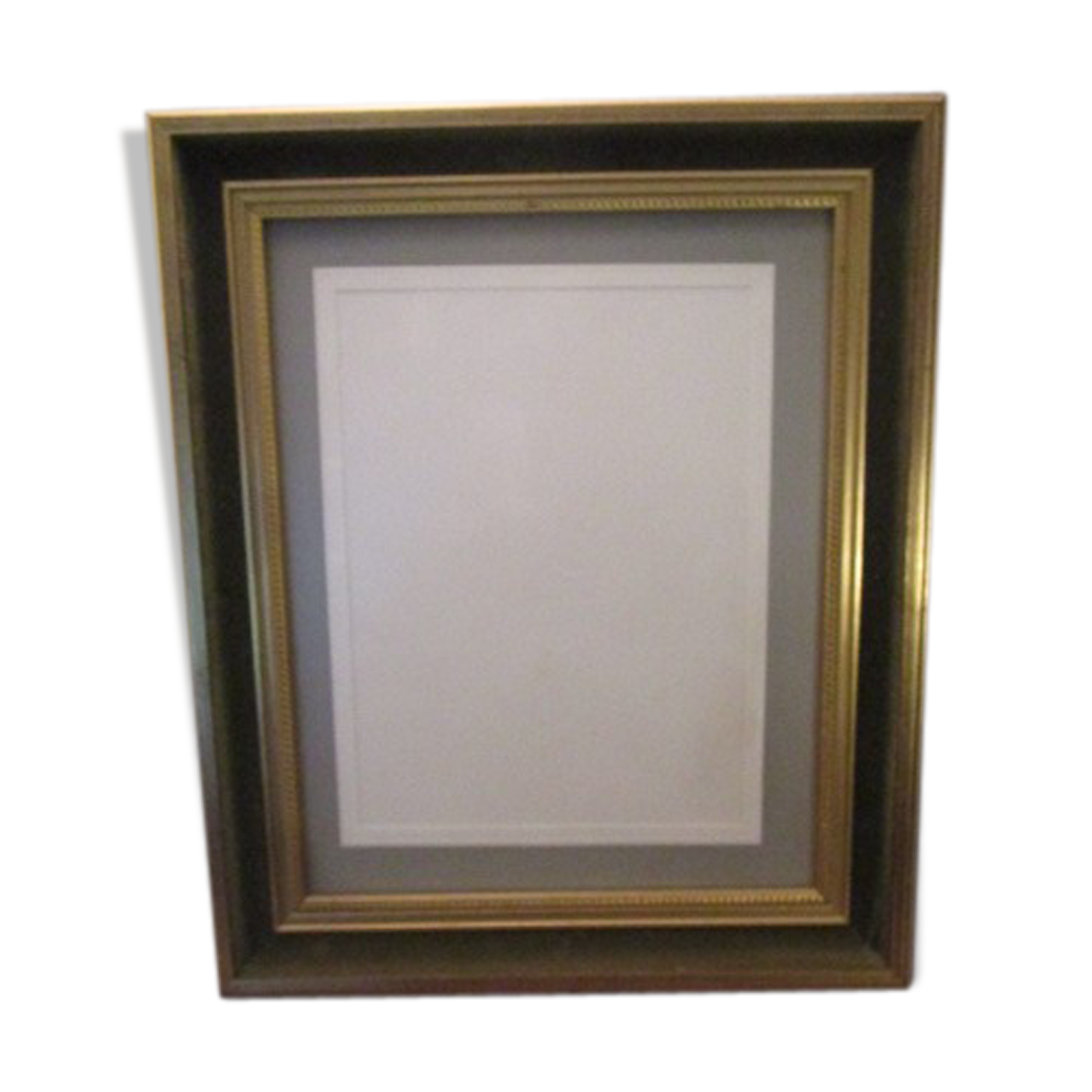 Old wooden and gilded stucco frame