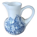 Small old pitcher in iron earth