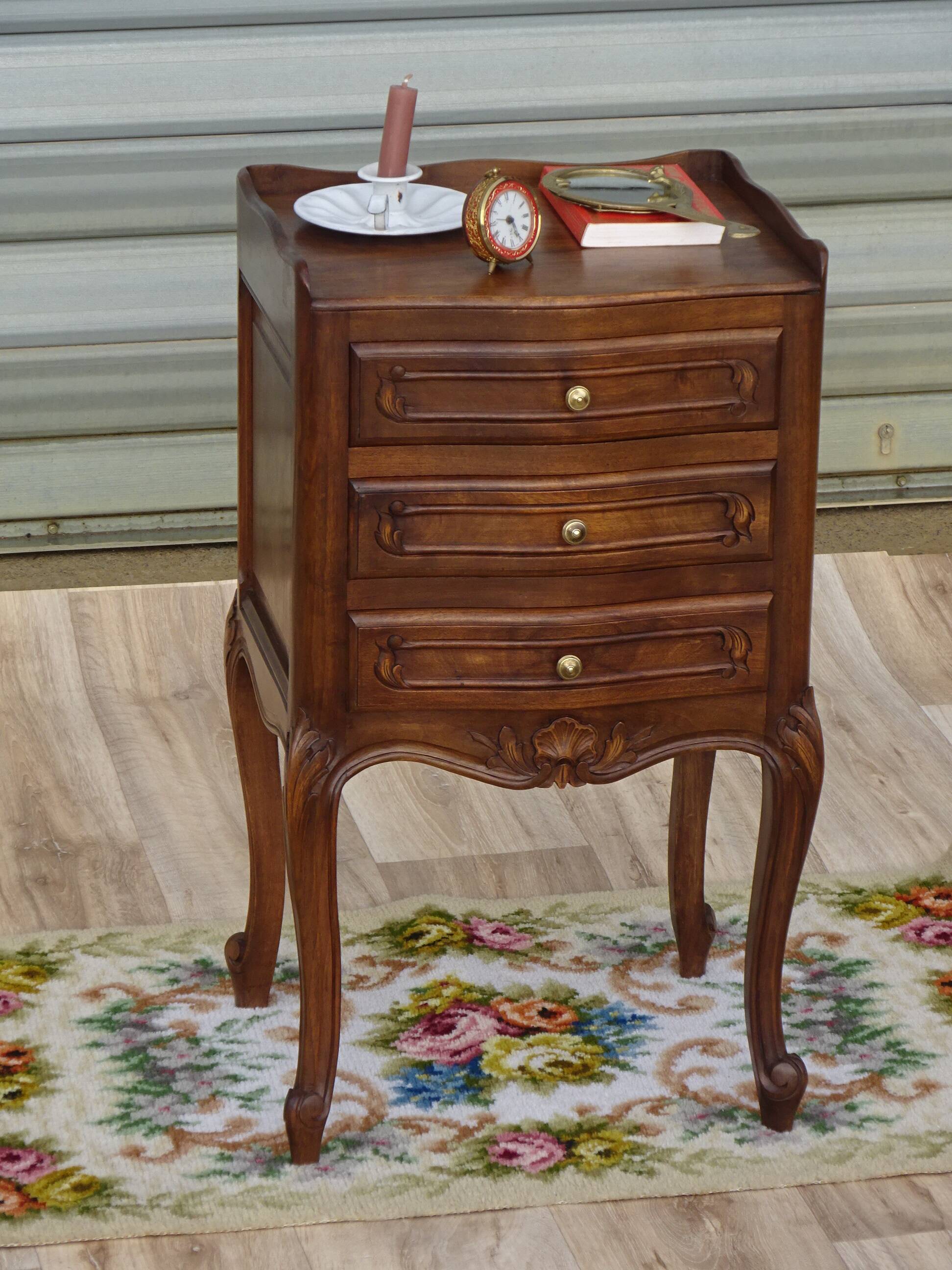 Louis XV bedside table in walnut, 3 drawers, raised edges on the tops.