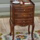 Louis XV bedside table in walnut, 3 drawers, raised edges on the tops.