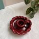 Twisted red earthenware candle holder - in the style of St Clément