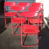 Red designer folding chairs from the 70s