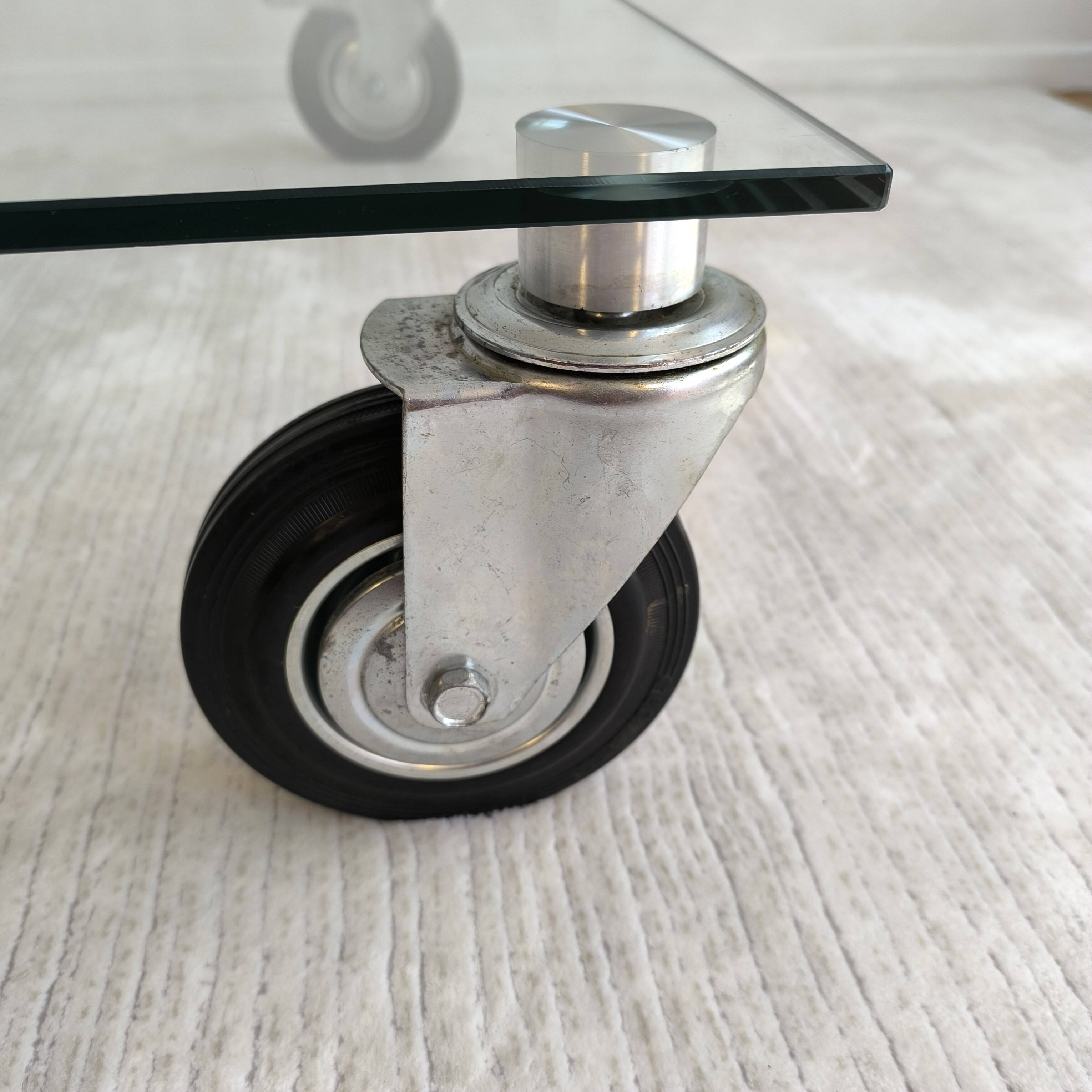 Beautiful designer glass coffee table on wheels