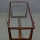Mid century glass topped coffee table