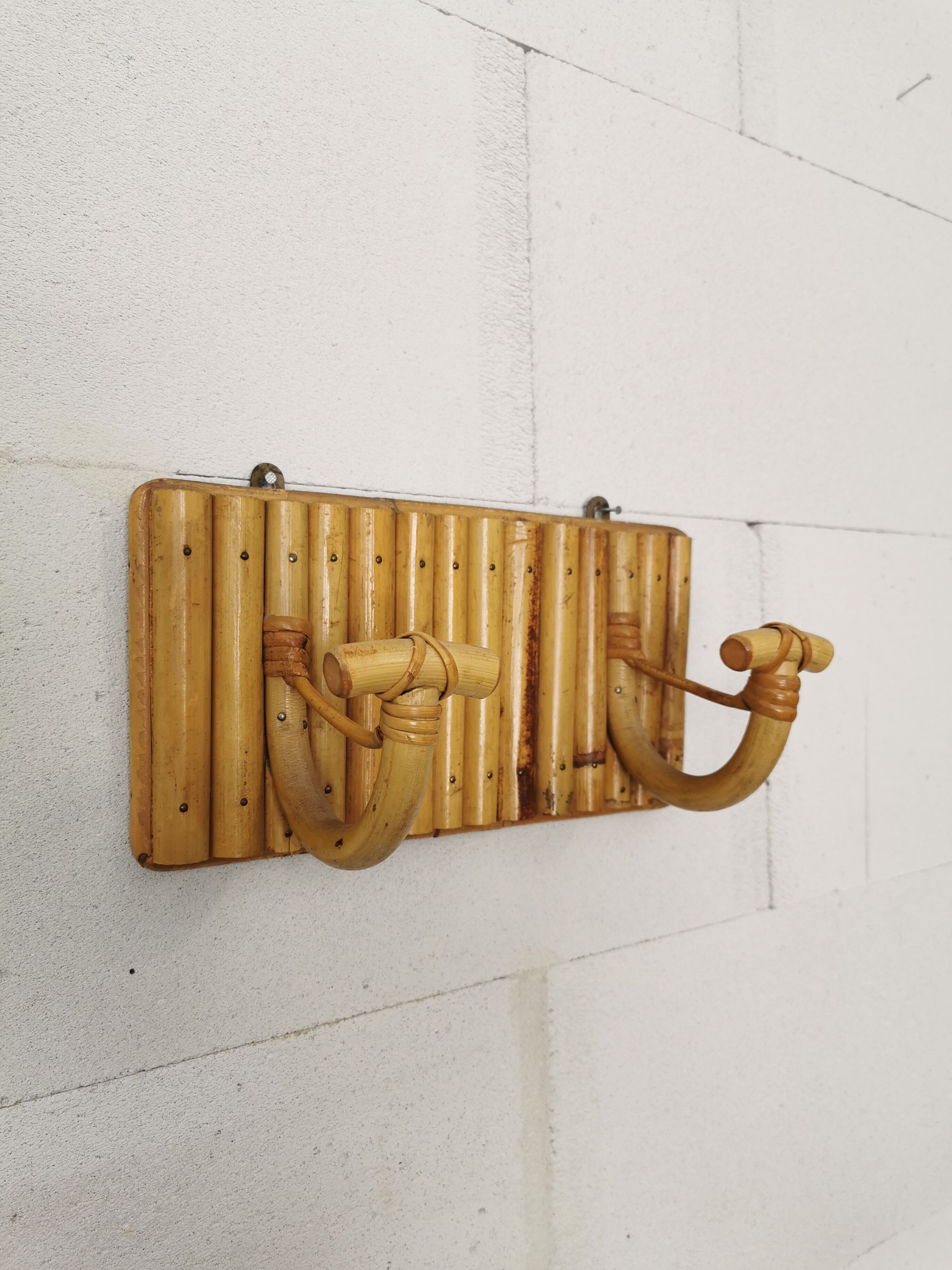 Wall coat holder in rattan