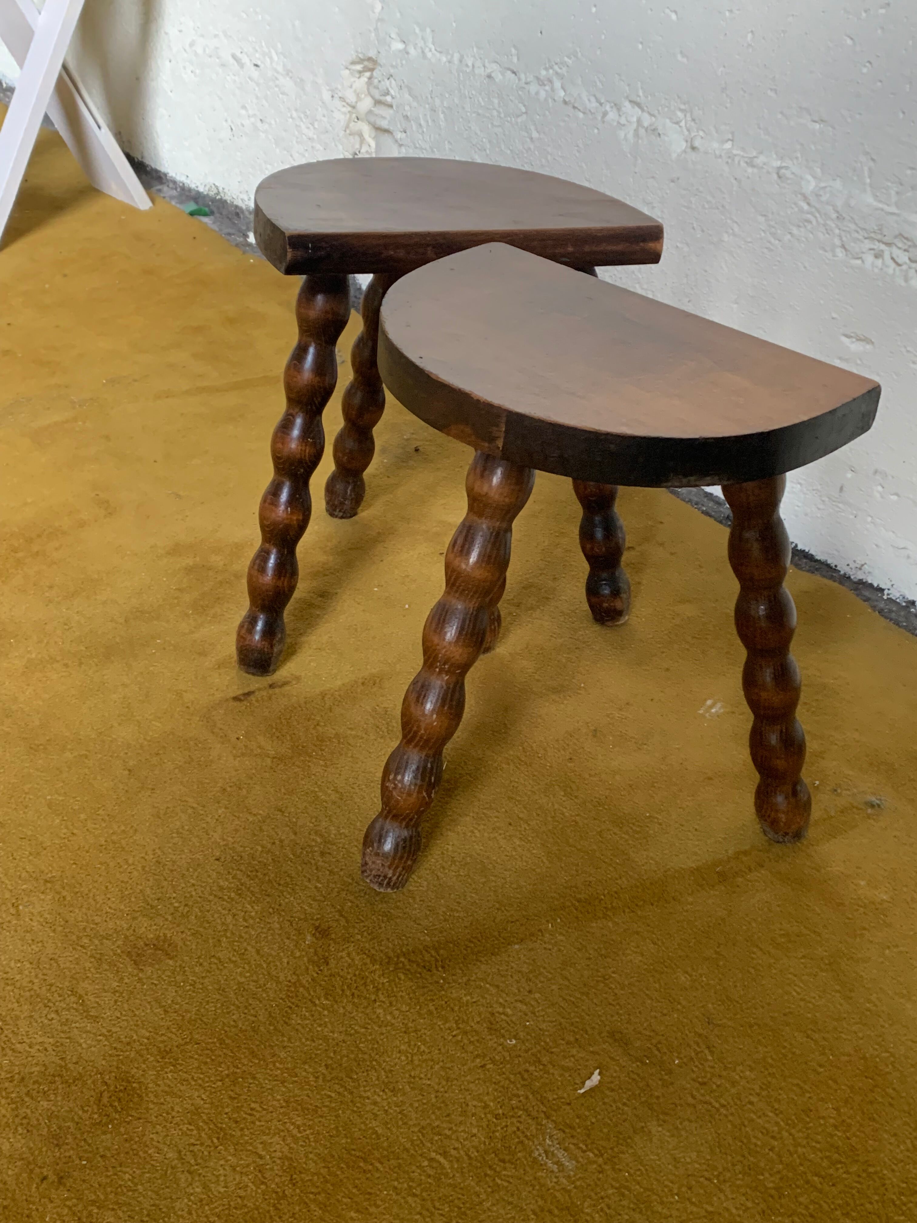 Duo of tripod half-moon stools