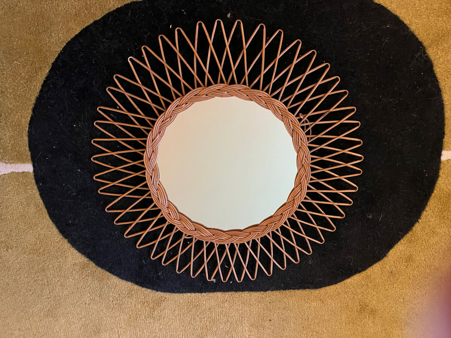 Round wicker mirror from the 1960s.