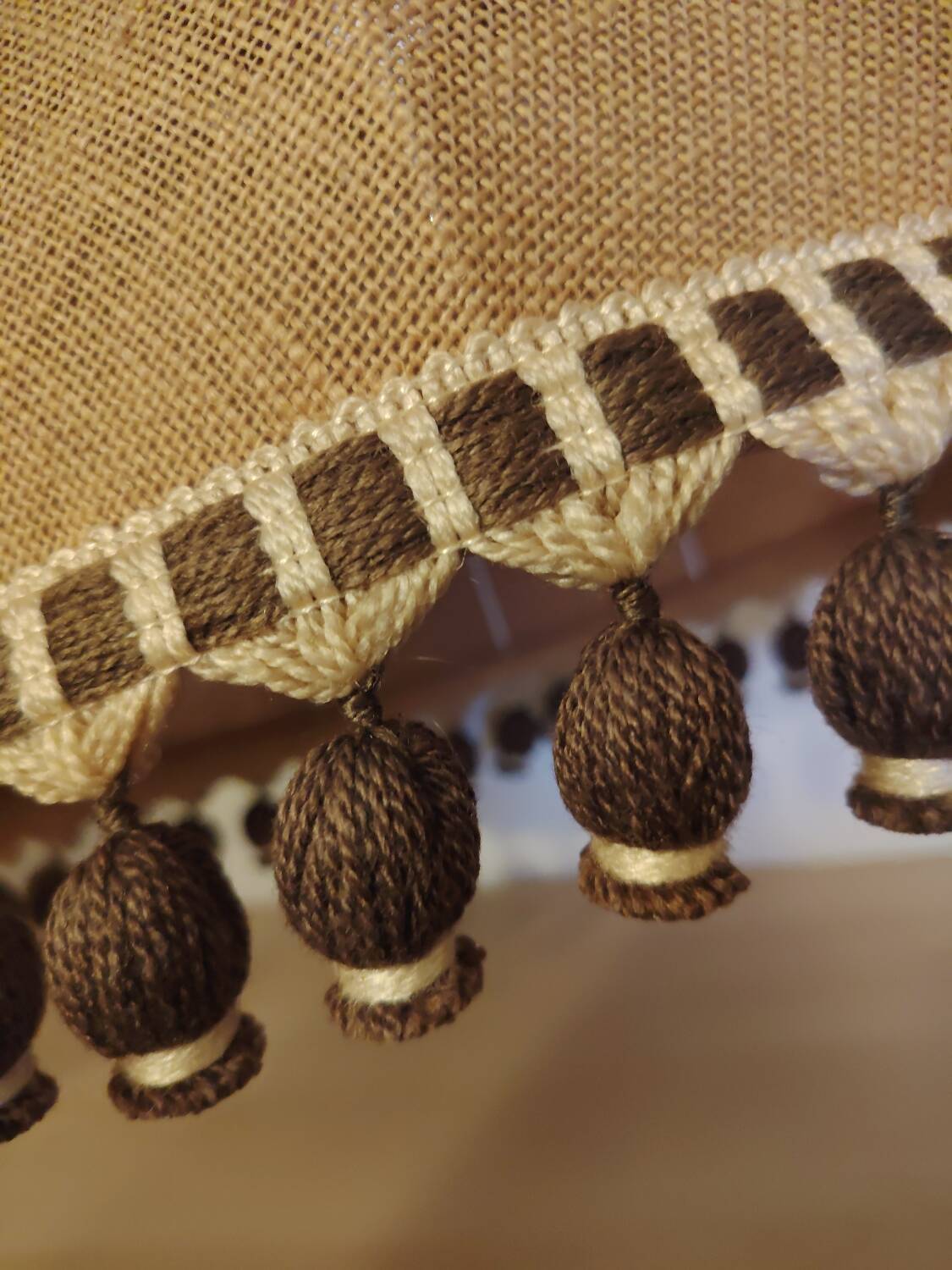 Large hanging pendant light with a burlap and pom-pom style