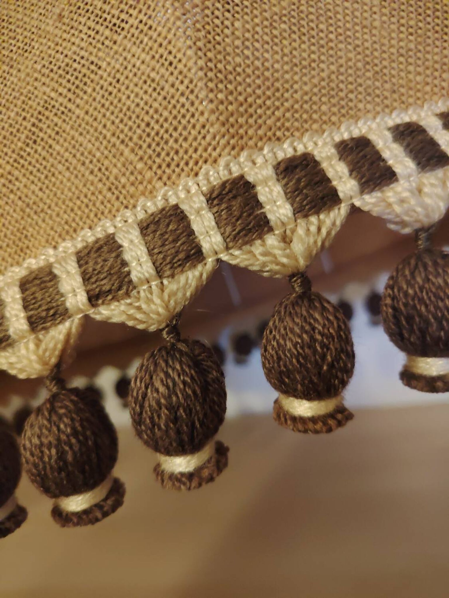 Large hanging pendant light with a burlap and pom-pom style