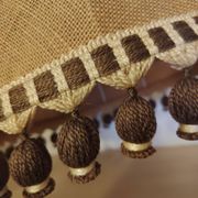 Large hanging pendant light with a burlap and pom-pom style