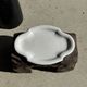 Antique oval-shaped white crackled faience plate with a scalloped edge.