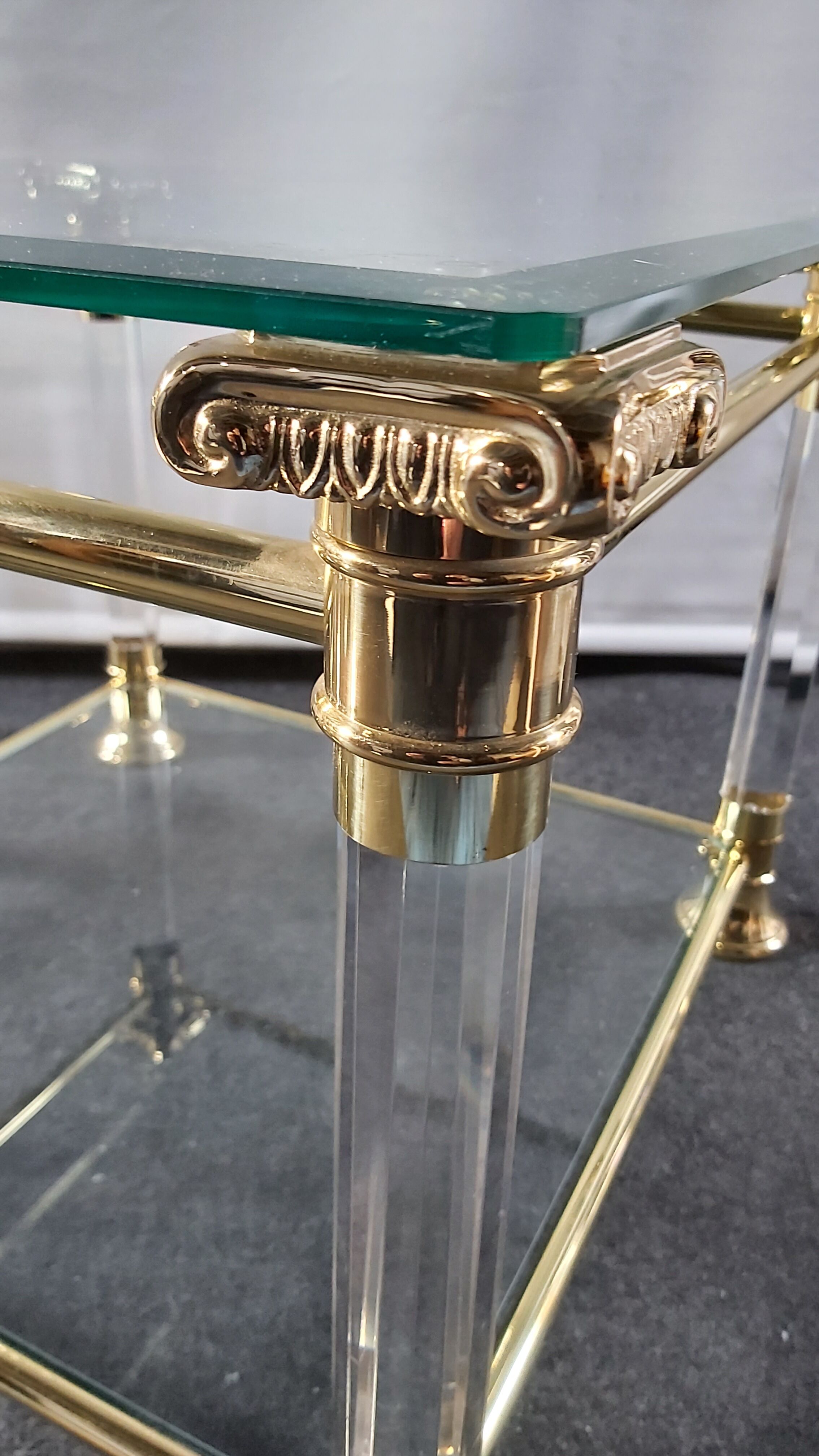 Pair of tables in brass, acrylic and glass