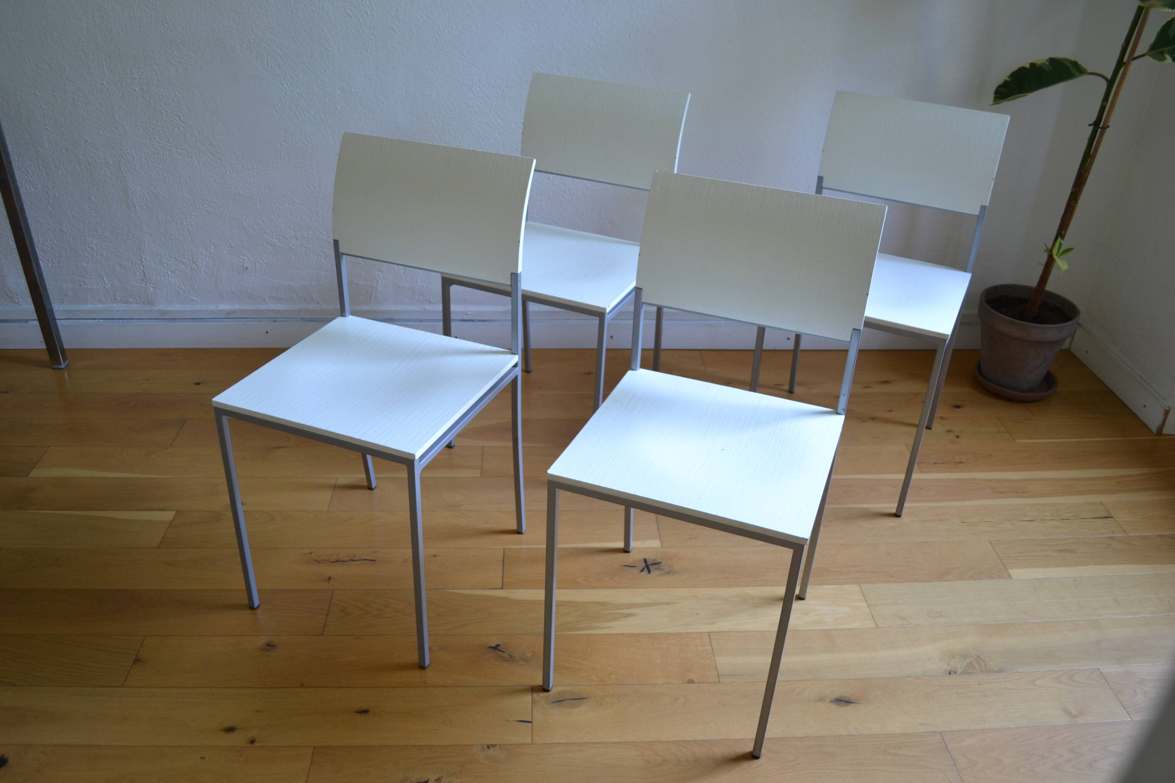 Set of 4 vintage metal and wood chairs from the 1990s.