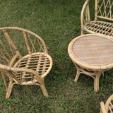 Set of children's rattan garden furniture from the 1950s and 1960s, including chairs, table, and bench.