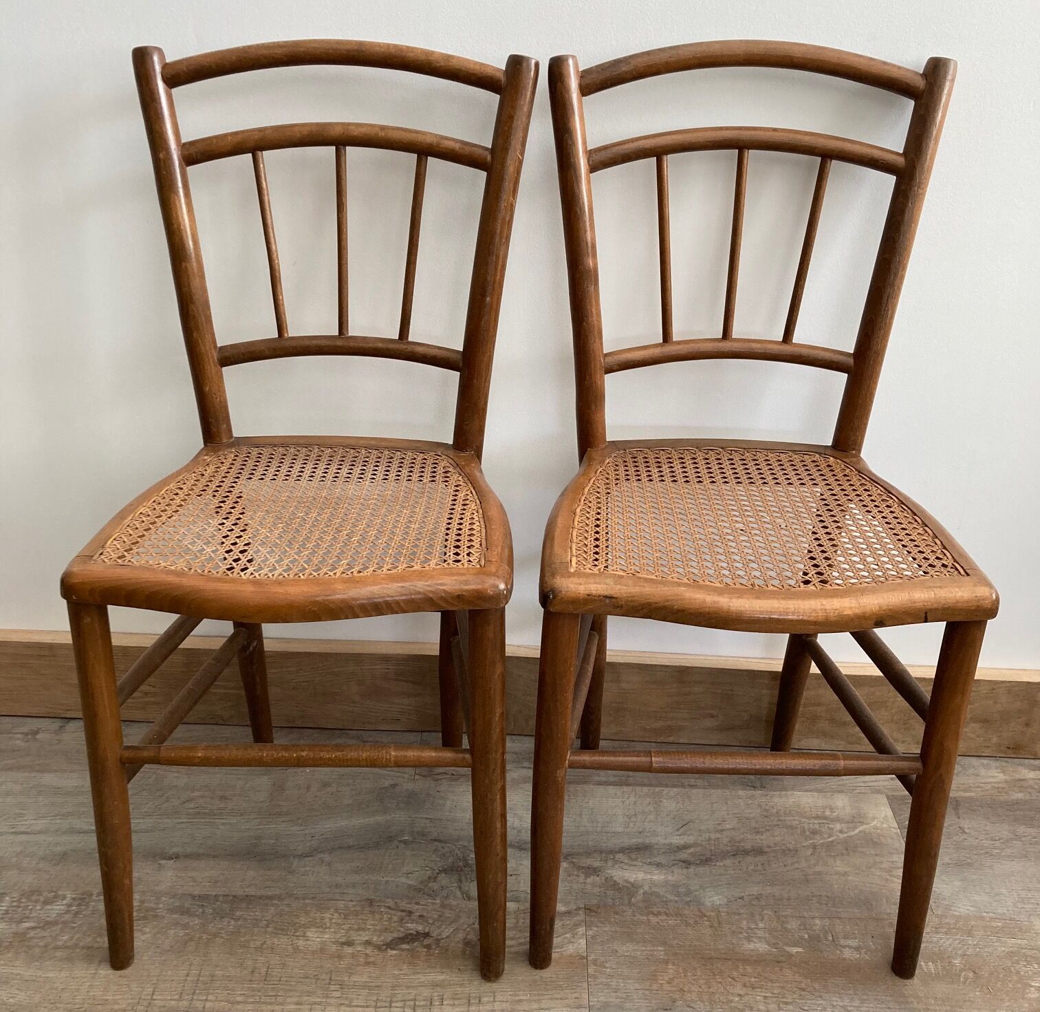 Set of 2 antique wooden bistro chairs canned seats