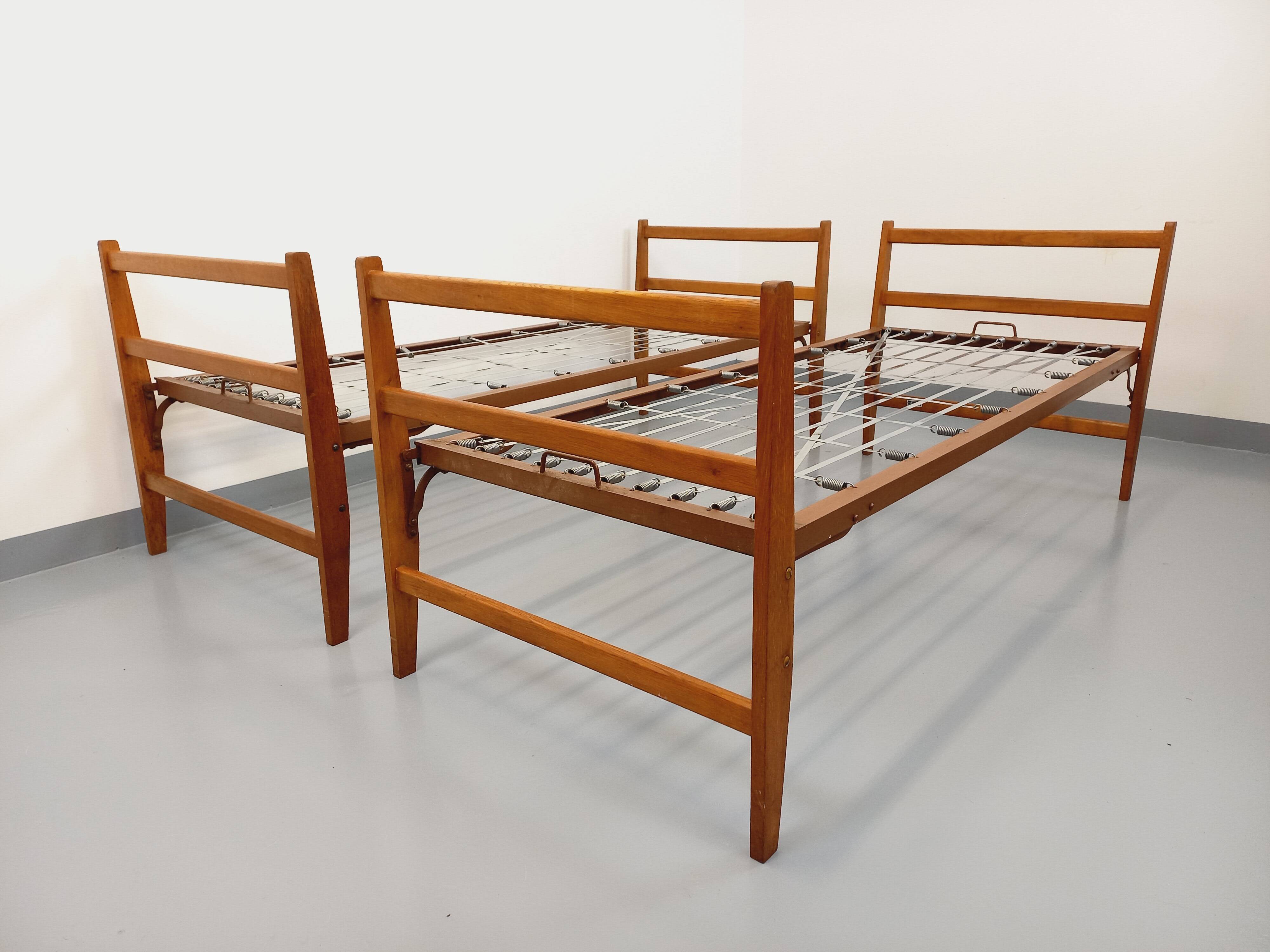 Pair of vintage stackable daybeds in oak wood and metal from the 60s