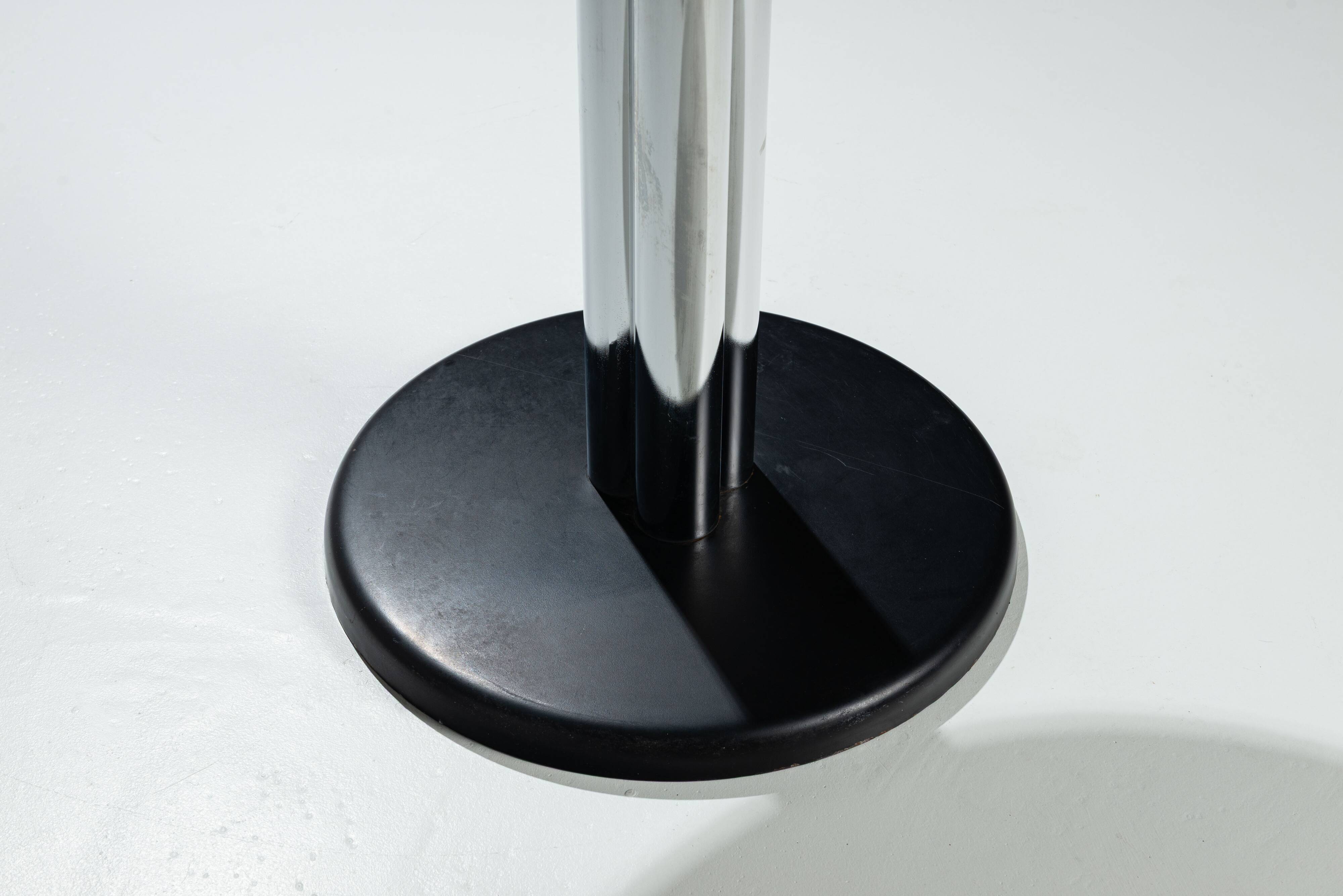 Round sidetable with stone top and three chromed legs