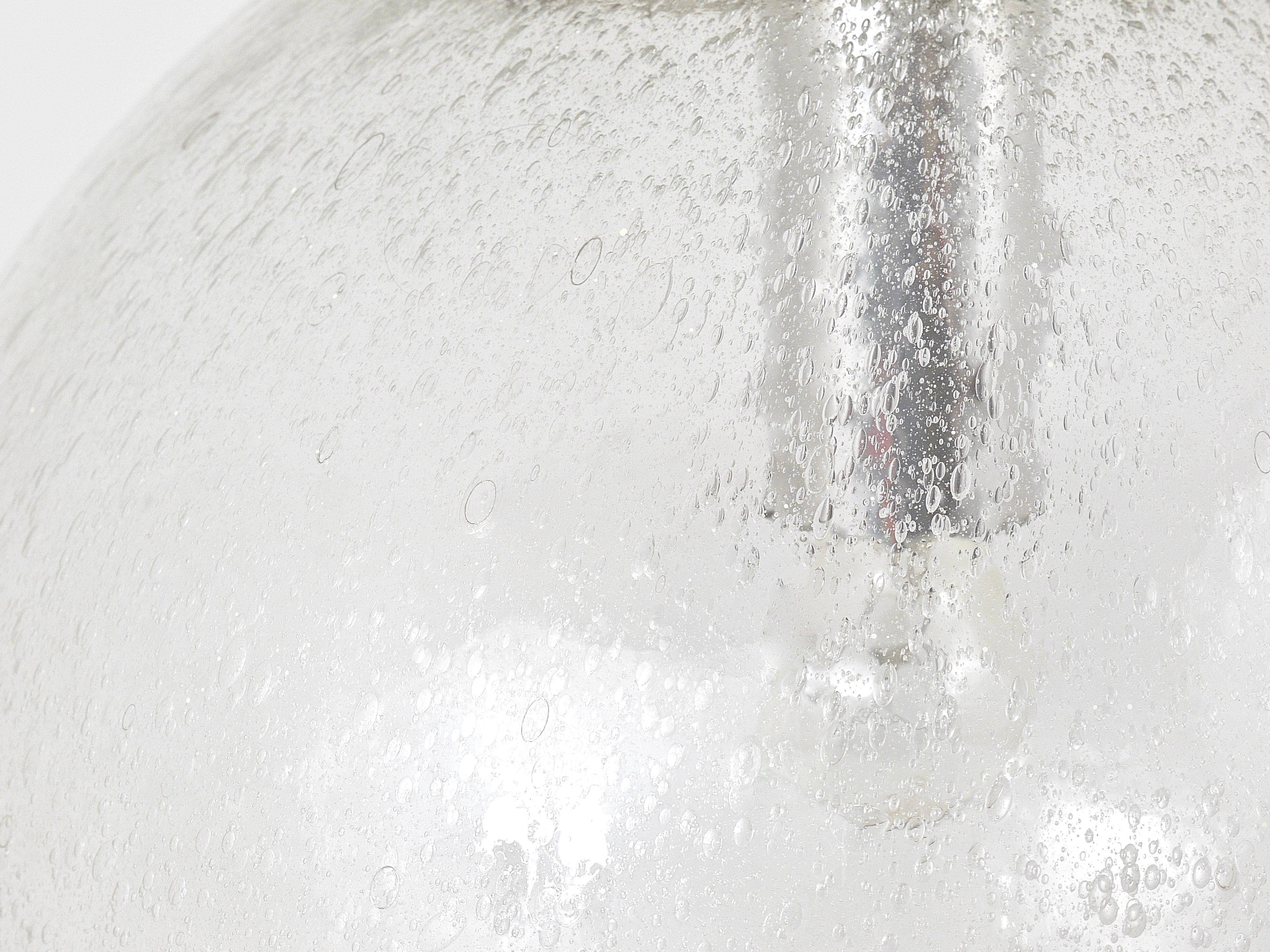 Large glass globe pendant light with bubbles and chrome by Peil & Putzler, Germany, 1970s.