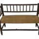 Vintage 'bobbin' bench with a rush seat, 1920s design with armrests.