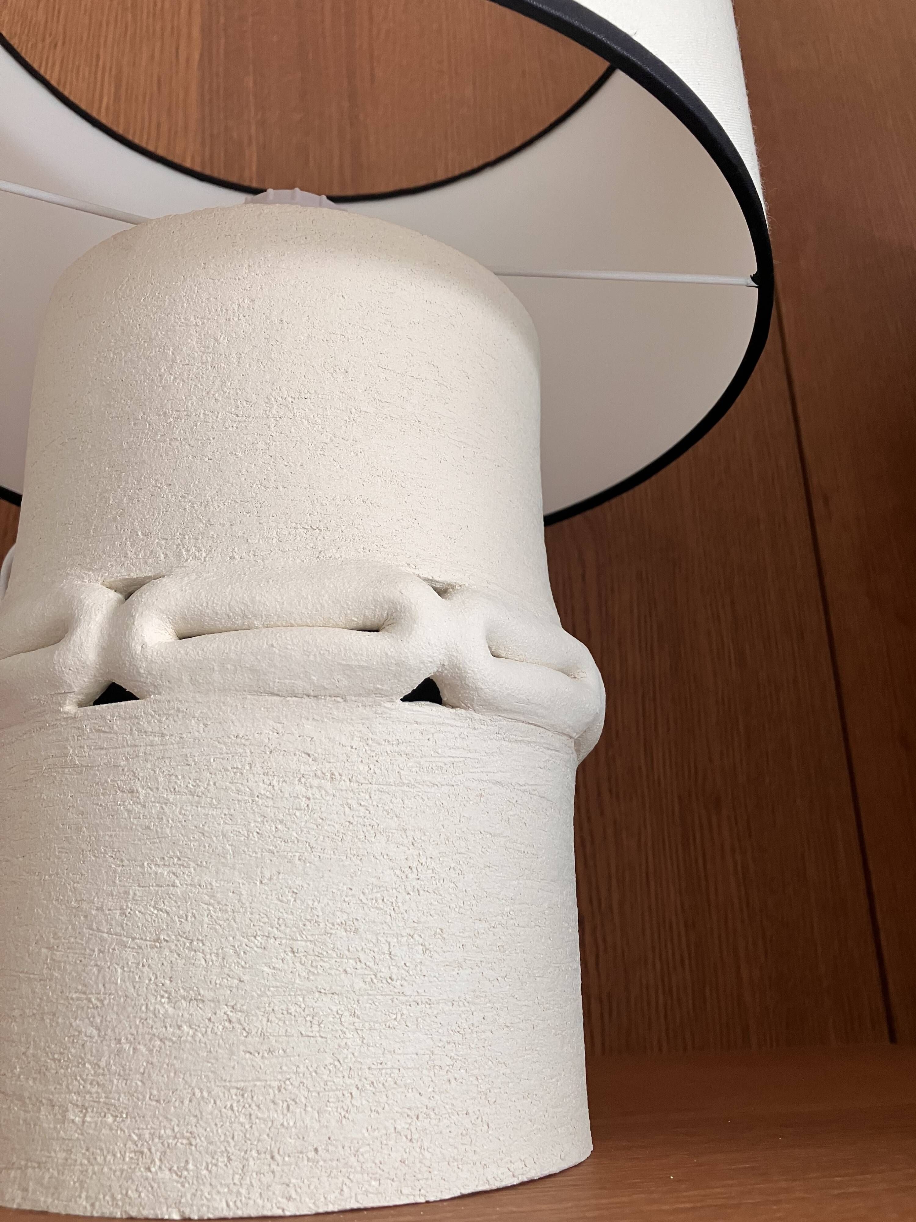 Table lamp in ceramic with a handmade couture-style lampshade from France.