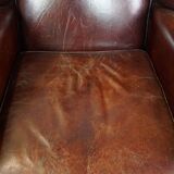 English style sheepskin leather wingback chair in a cognac color