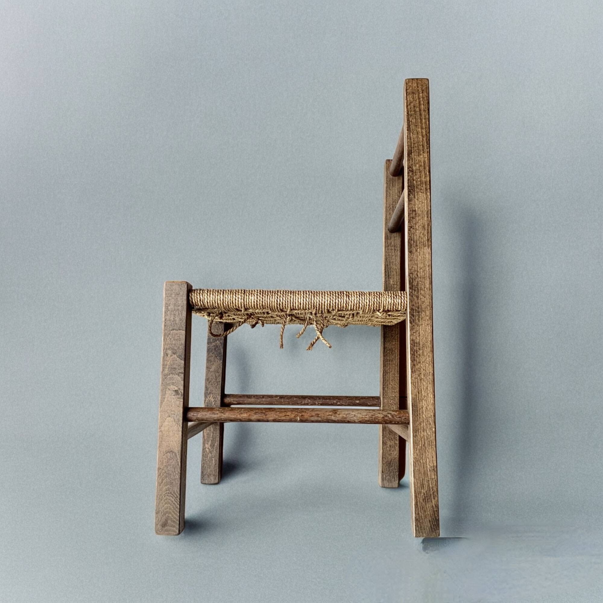 Vintage children's chair made of rope and wood