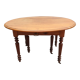 Table ovale 6 pieds avec allonges patine caramel