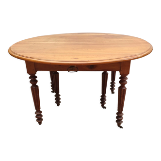 6-foot oval table with caramel patina extensions