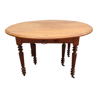 Table ovale 6 pieds avec allonges patine caramel