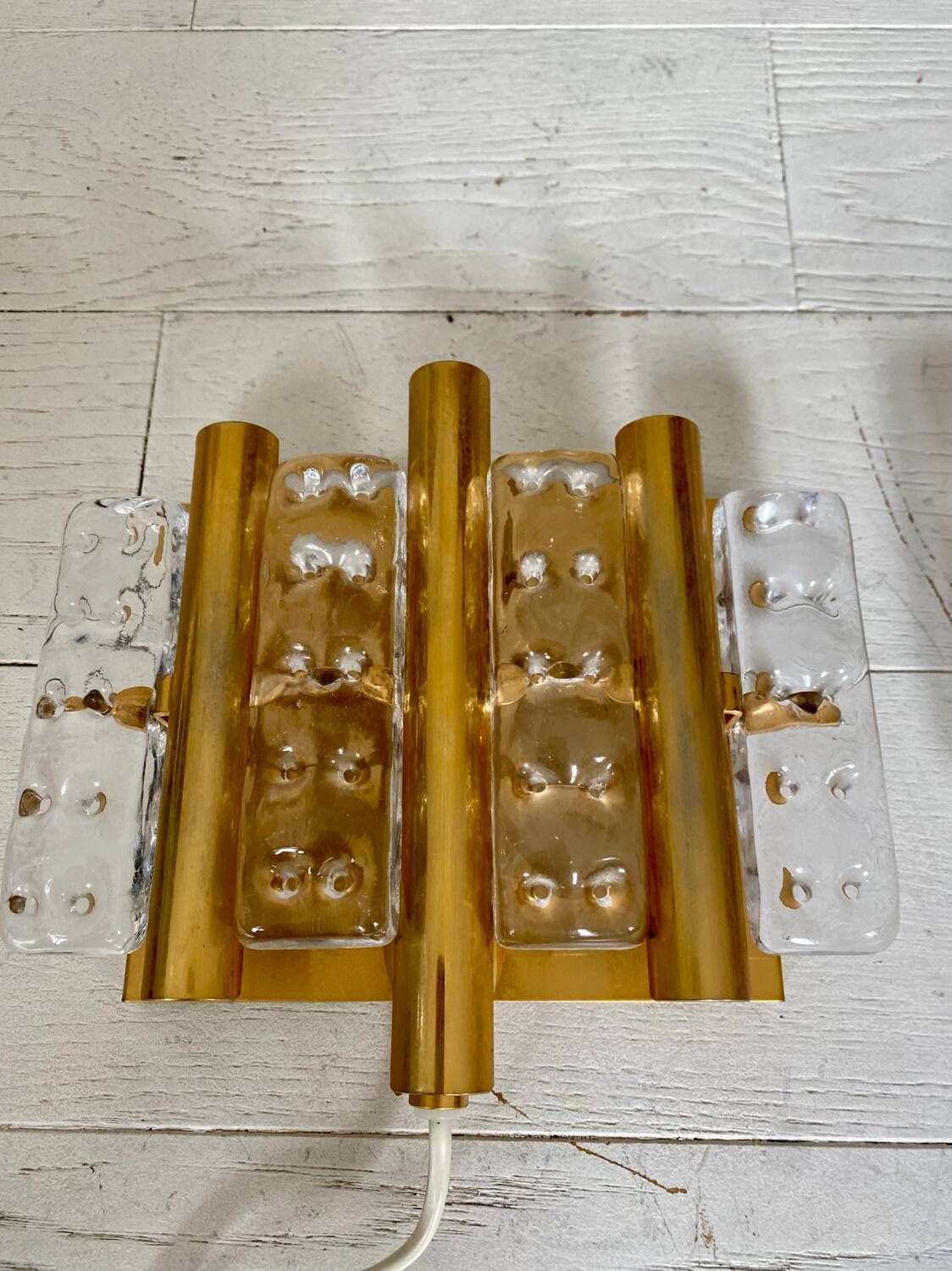 HANS AGNE JAKOBSSON. A pair of glass and brass wall lights