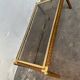 Gold metal coffee table with elm burl imitation.