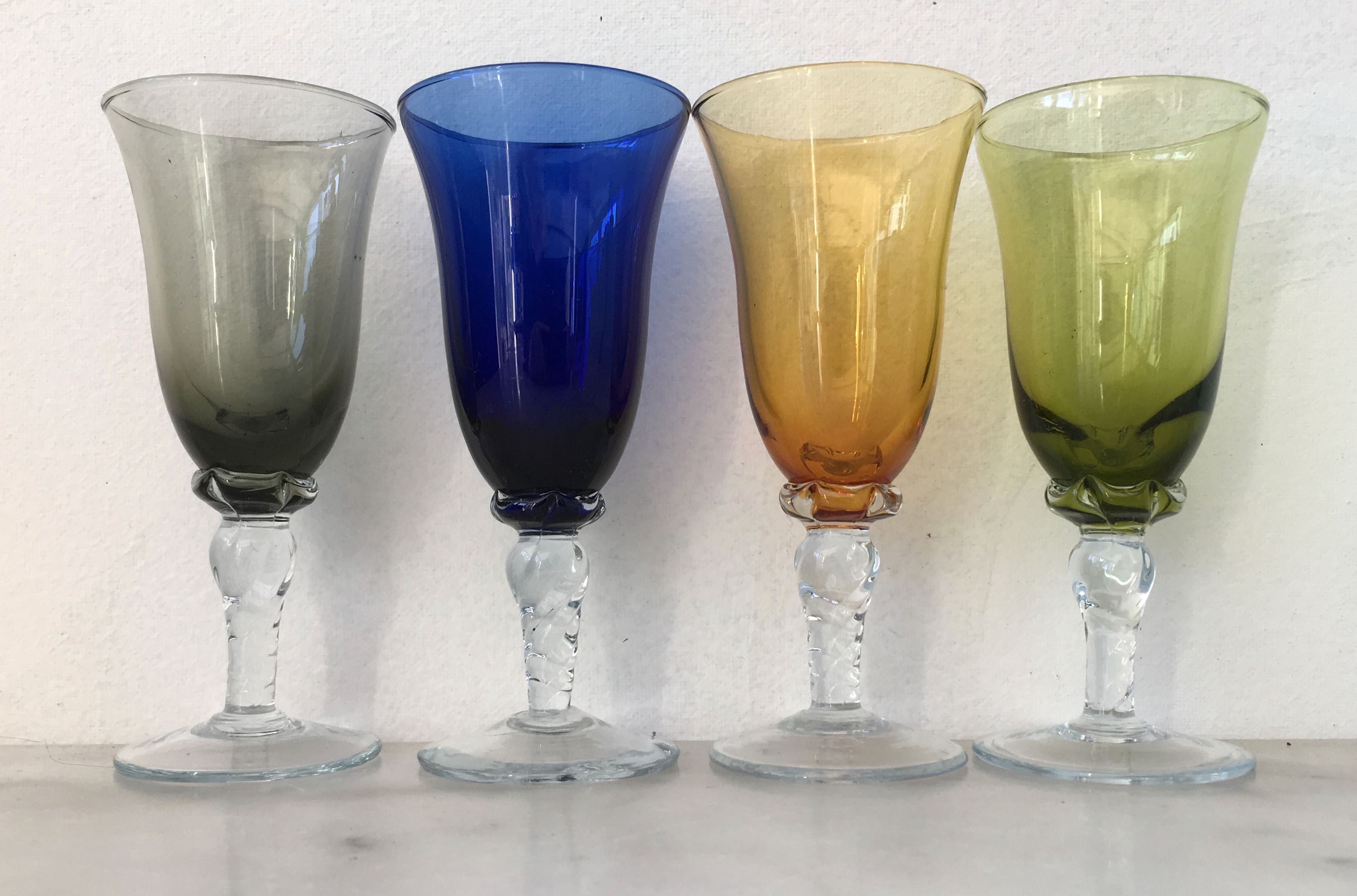Set of four colored blown glasses