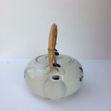 Vintage teapot with rattan handle
