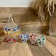 Vintage carafe and its 3 graphic style liqueur glasses.