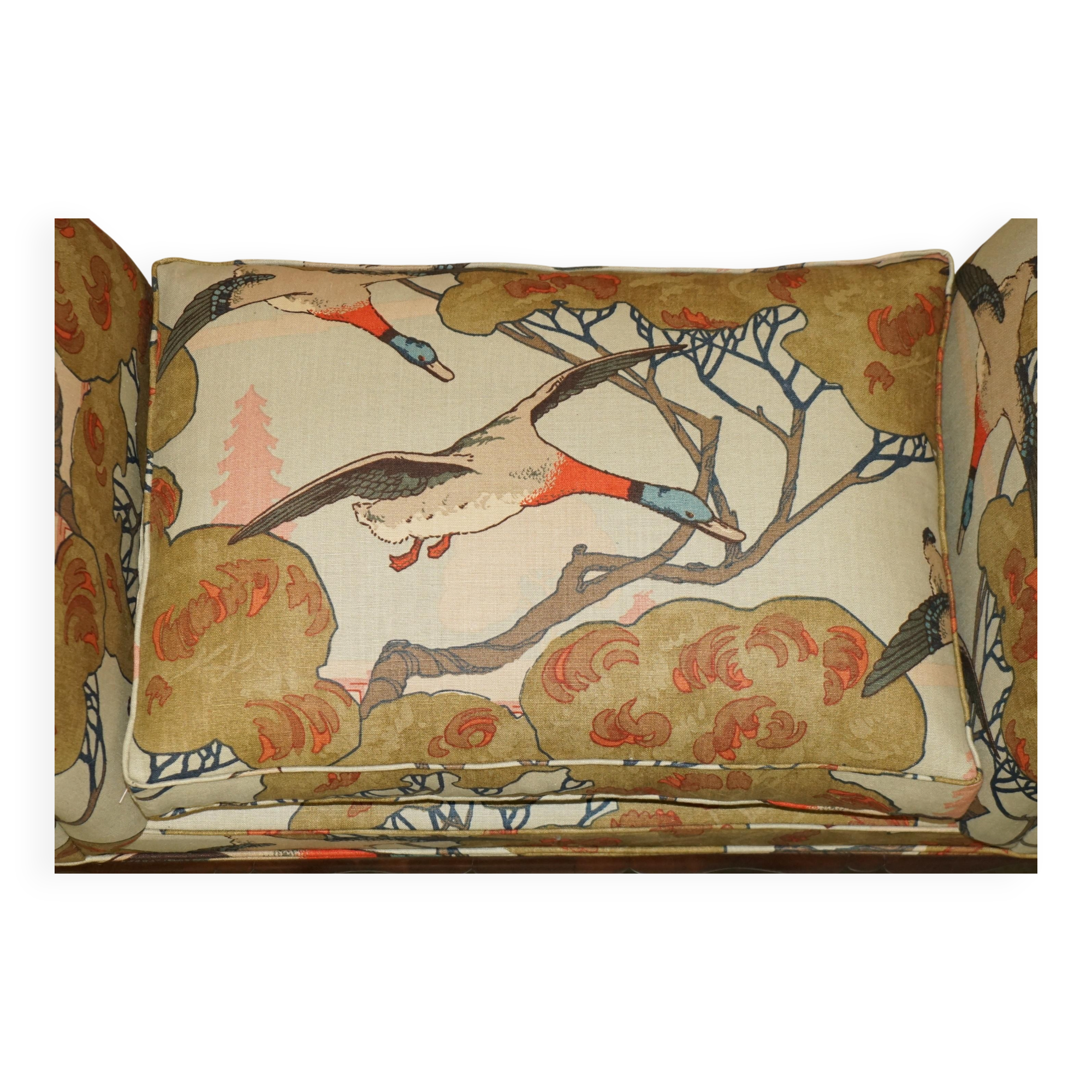 Antique banquette with cluster and ball feet, window seat in Mulberry Flying Ducks fabric.