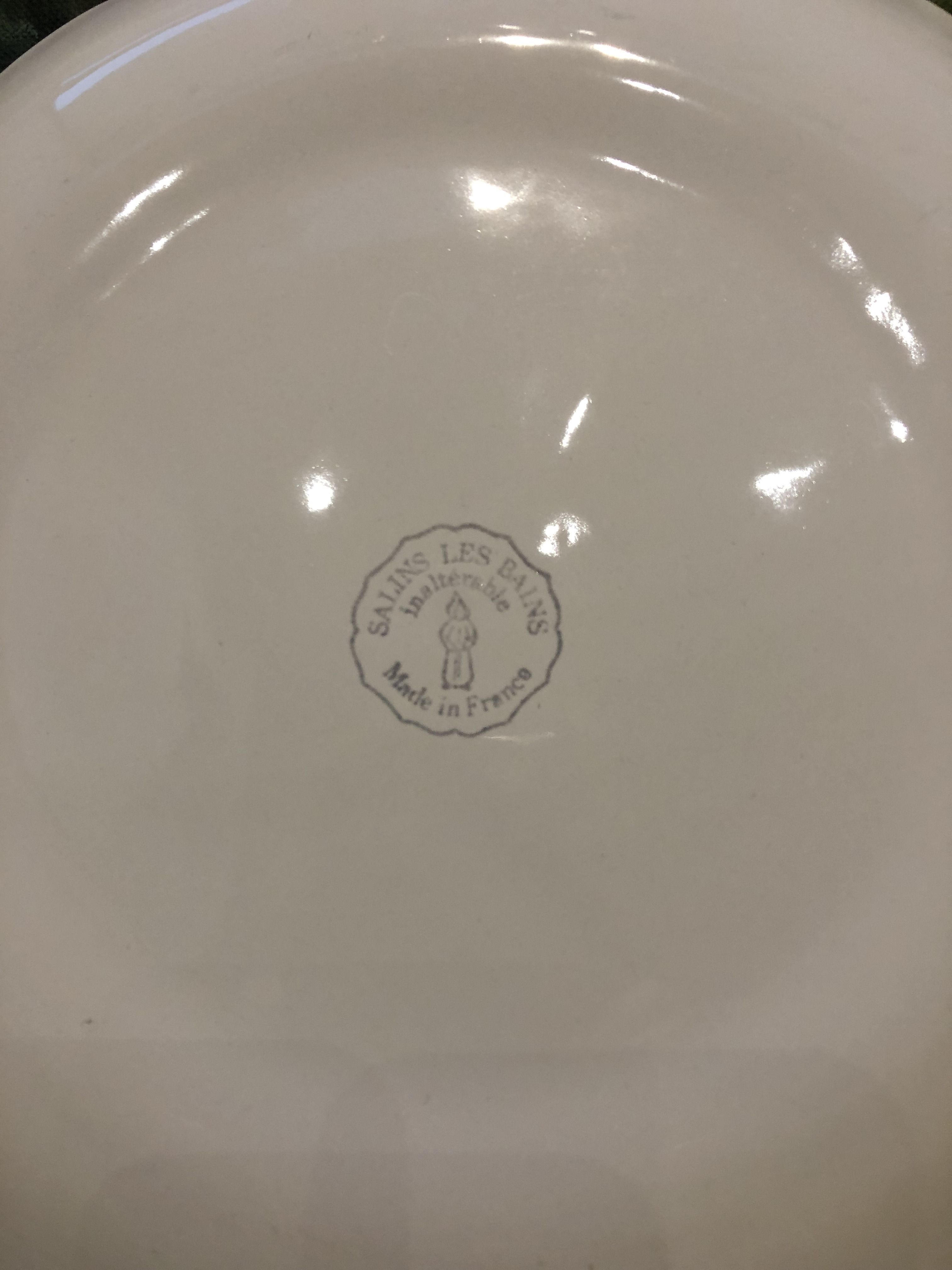 Old flat plate in the shape of saline pink fish baths made in France